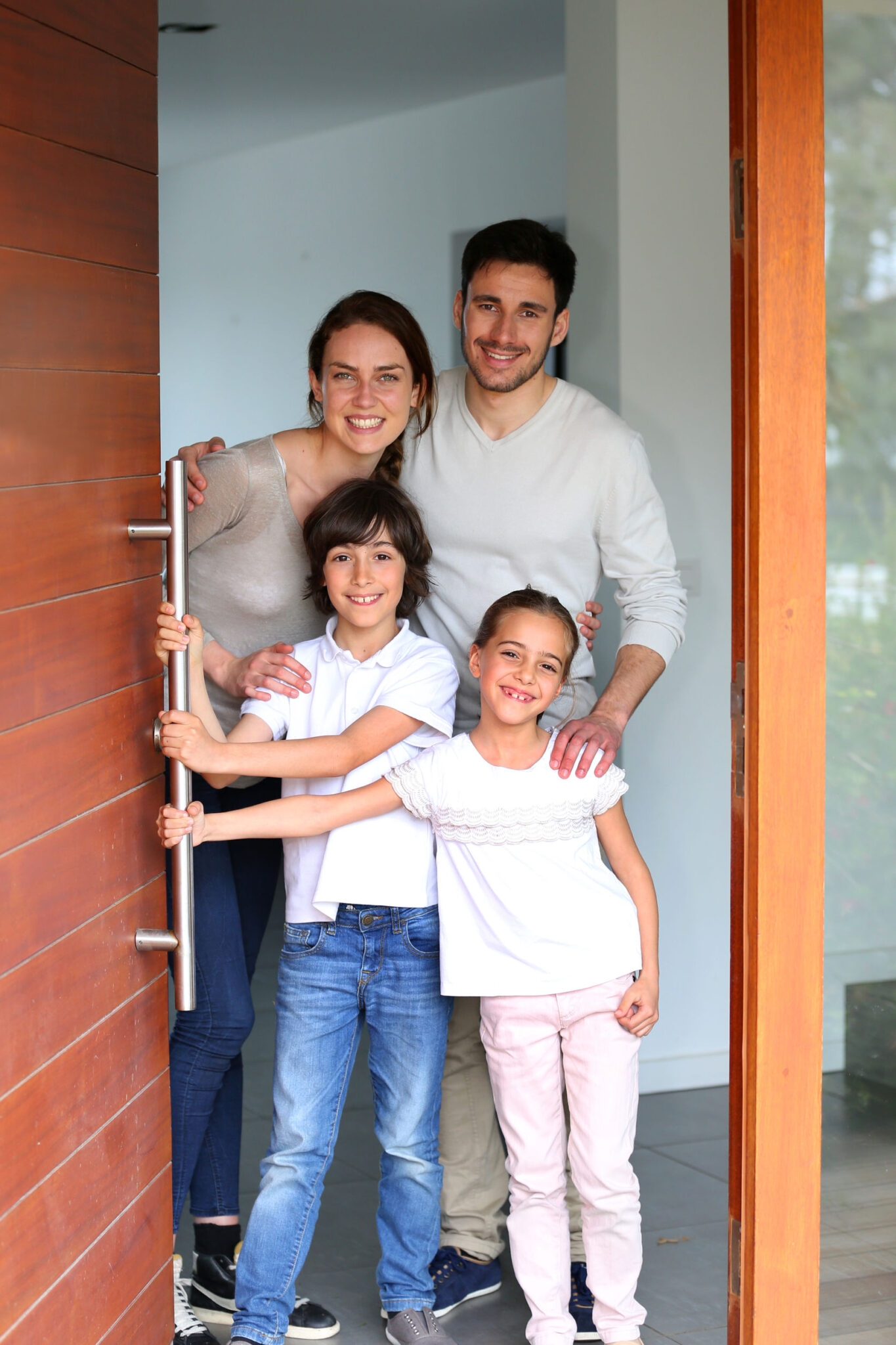 Family happy to welcome people in brand new home