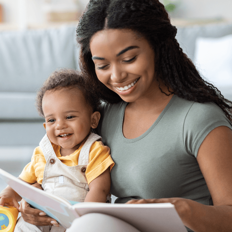 Barnes Nanny reading a book to a child