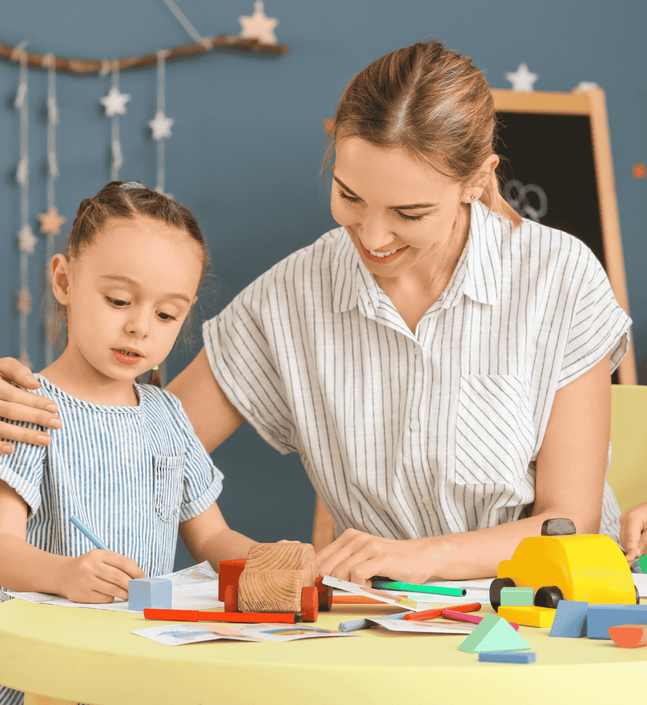 Nanny helping a young girl with homework