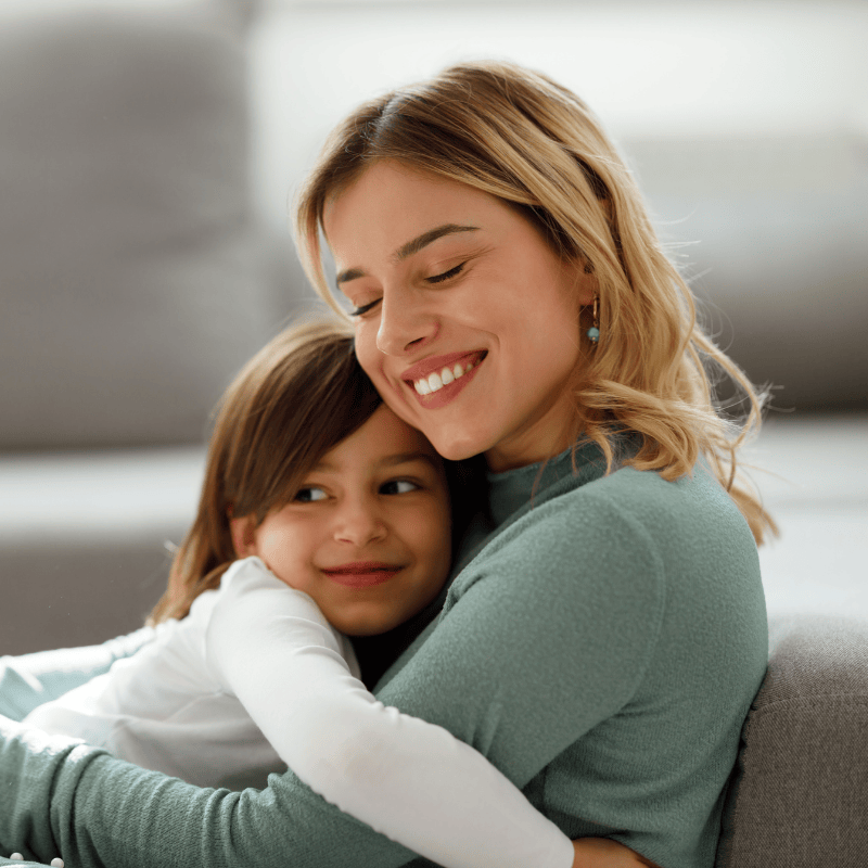 Nanny and child hugging