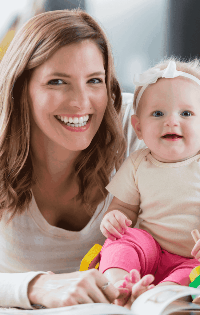Nanny smiling with a baby
