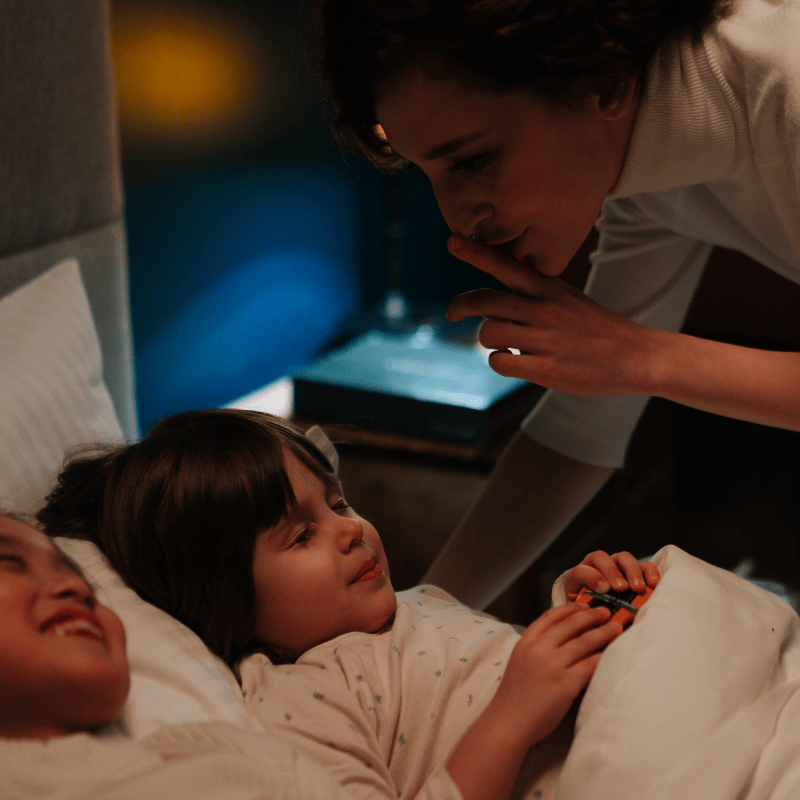 Nanny getting children to sleep