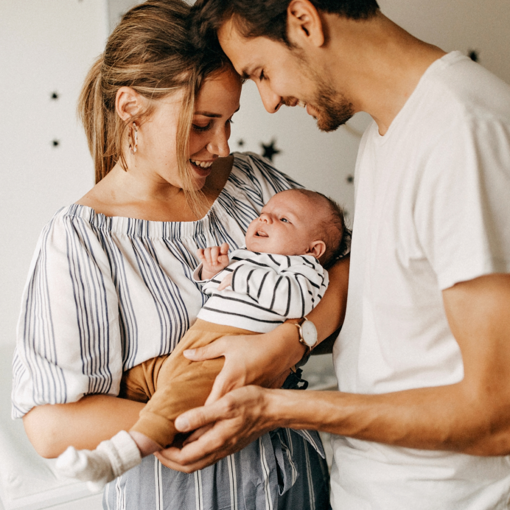 couple holding their baby
