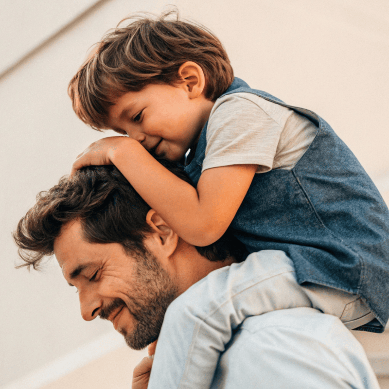 Son on fathers shoulders