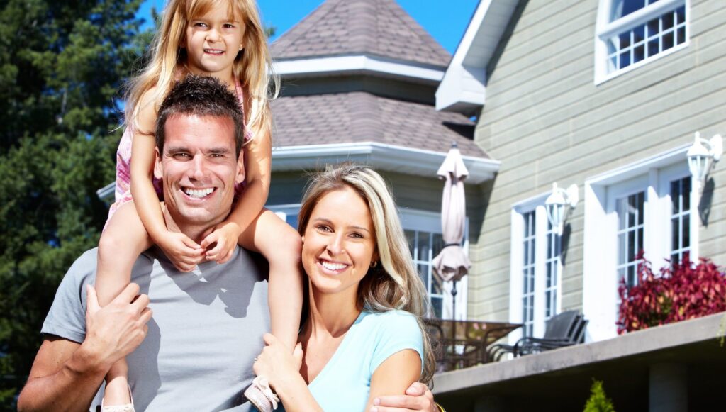 HNW family in front of their house