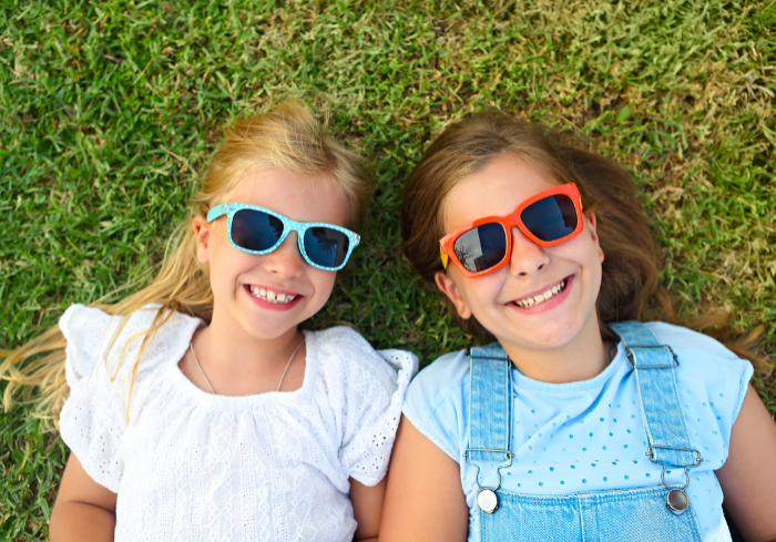 2 young girls with sunglasses 700 x 500
