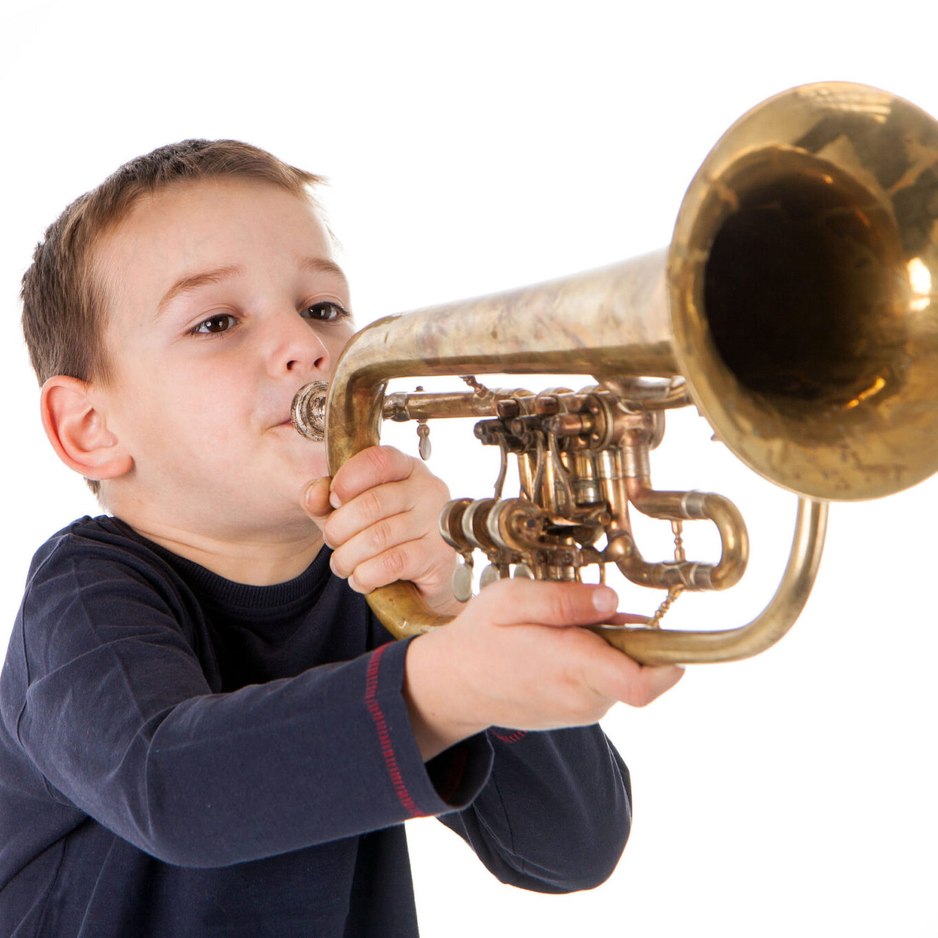 Boy blowing his own trumpet